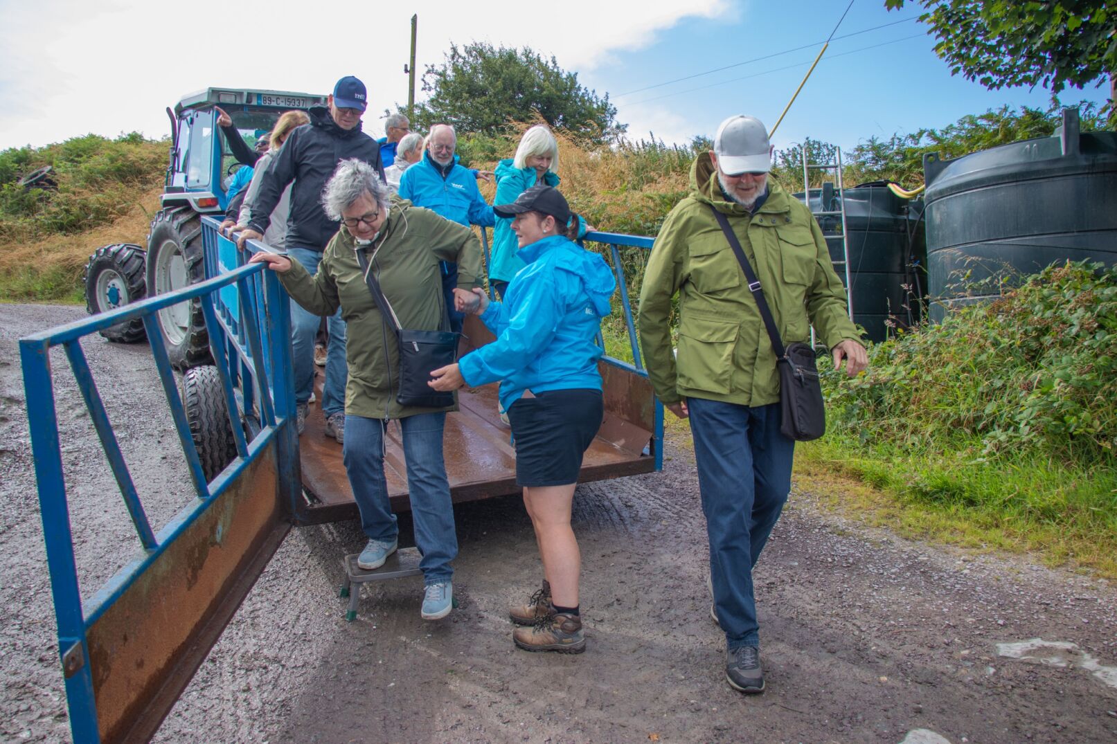 Visitors guided off a trailer