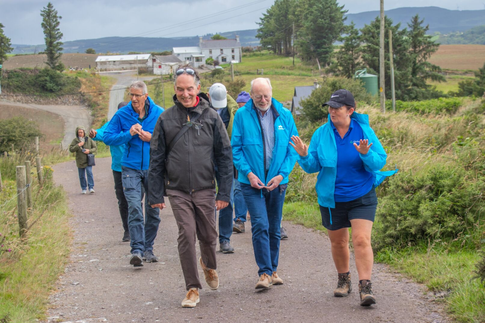 Visitors walking on a farm road